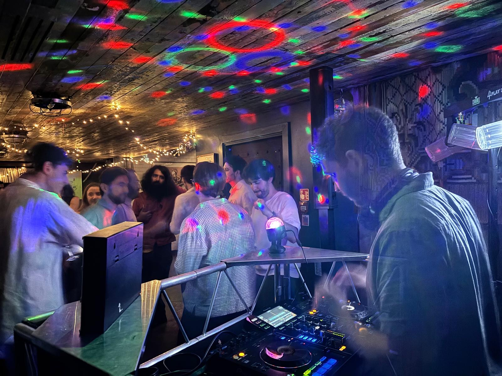 DJ playing to a lively crowd